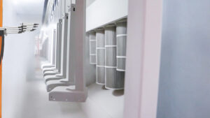 Contuo robotic powder coating system applying 60μm epoxy finish to alloy standing desk legs with ±5μm accuracy, ISO 14001 eco-certified facility reducing VOC emissions by 90%.