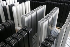 ISO 9001 certified warehouse storing 1200+ Contuo desk legs with color-coded pallets (black/white/silver), 50 sets per pallet, RFID tagged for EU/US shipment in 28 days .